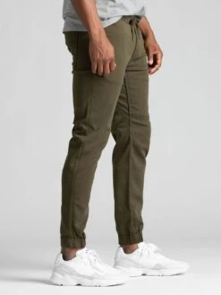 No Sweat Jogger Pants(Duer No Sweat Jogger Pants Co) -ThinkEmpire Shop man wearing army green athletic joggers side 1200x1682 92b78025 cef0 4e56 a282 462211efc3dc